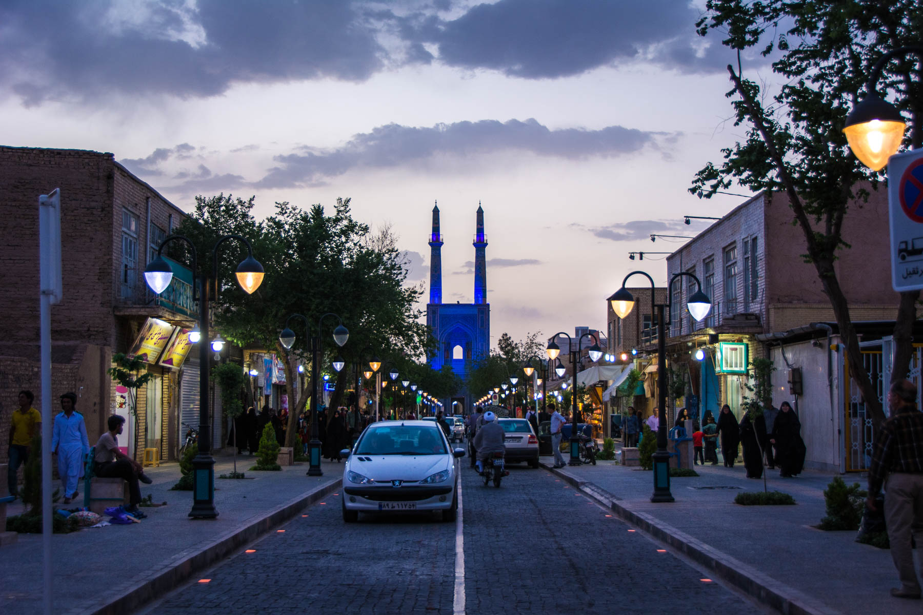 Cars driving at night in Yazd, Iran in front of Jameh mosque