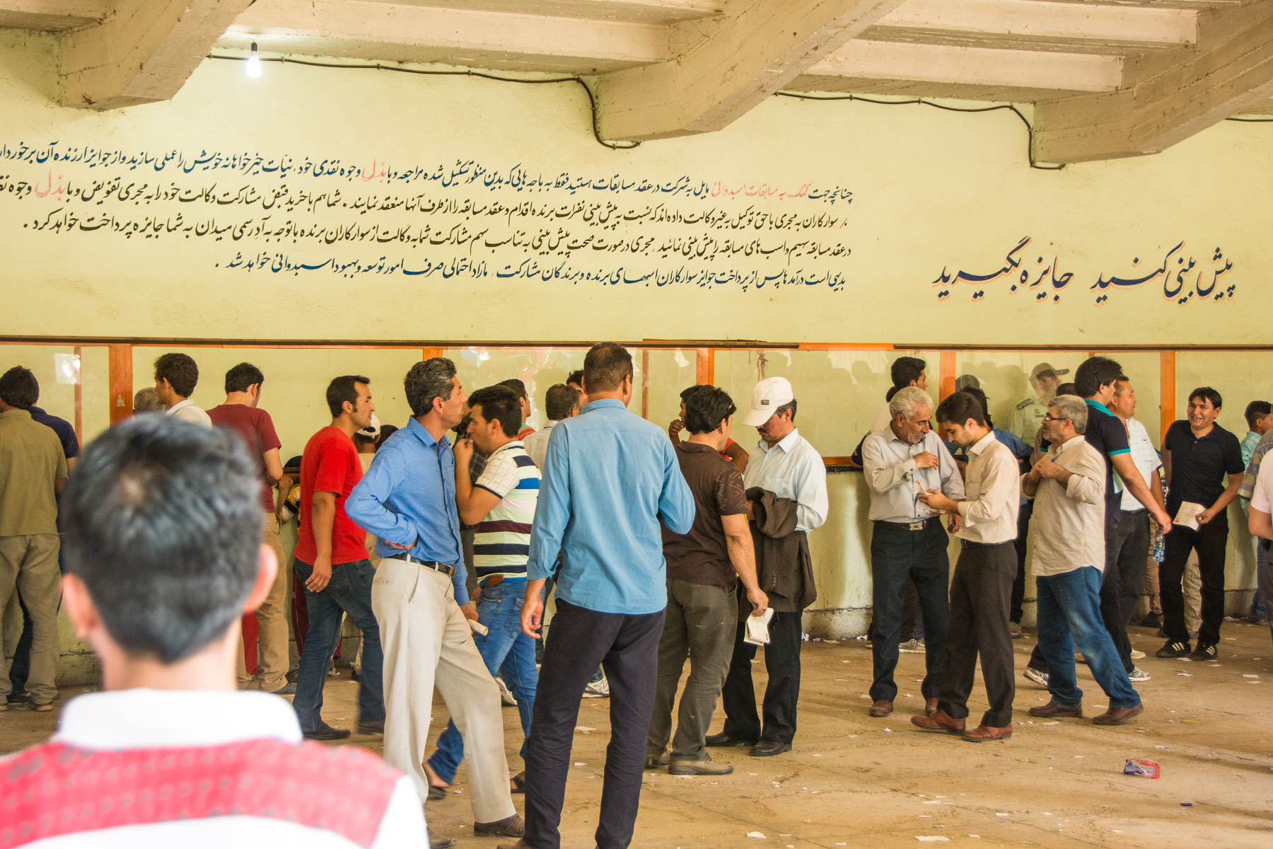 People placing bets at the horse races in Gonbad-e Kavus, Iran.