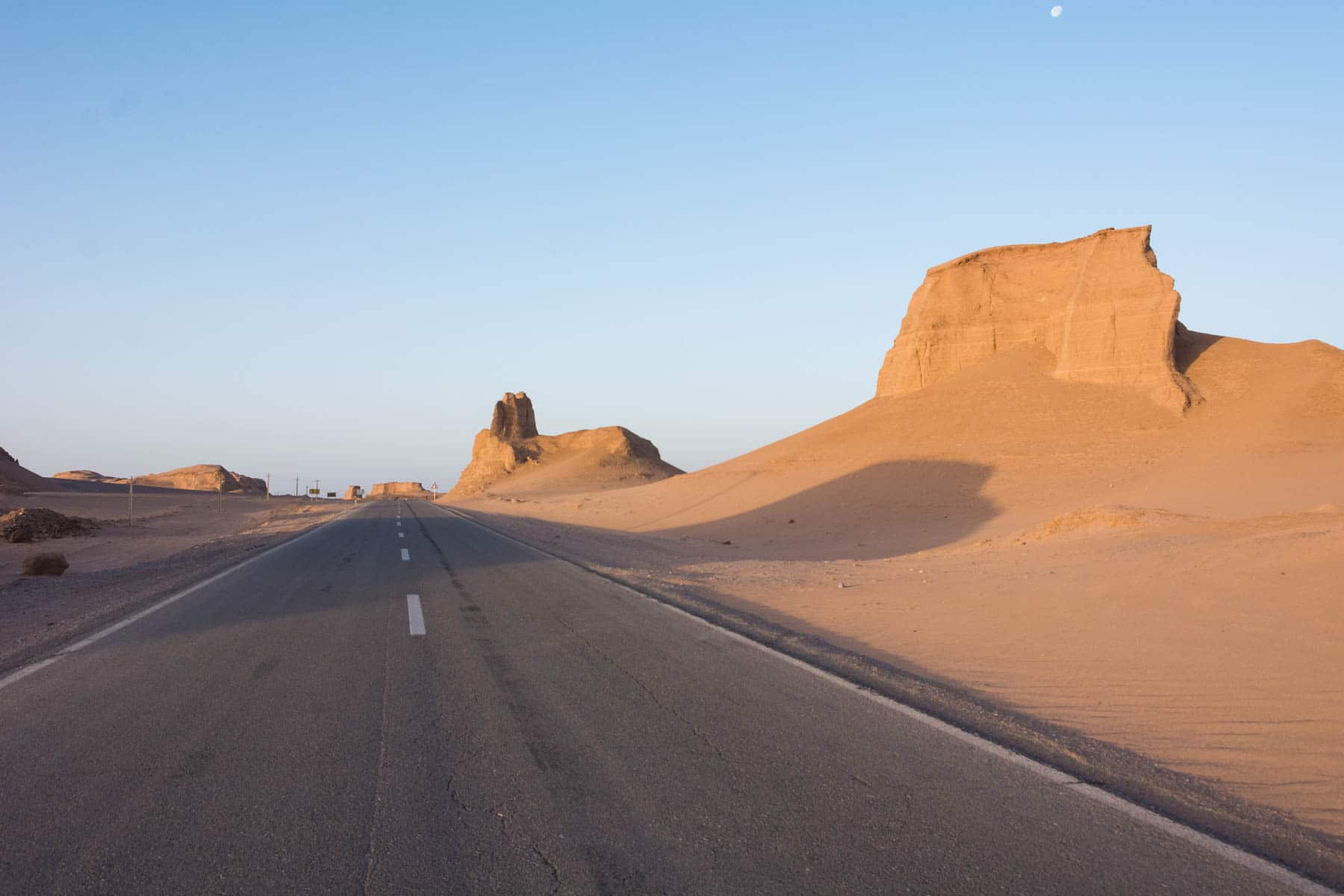 A road running through the Kaluts desert in Iran