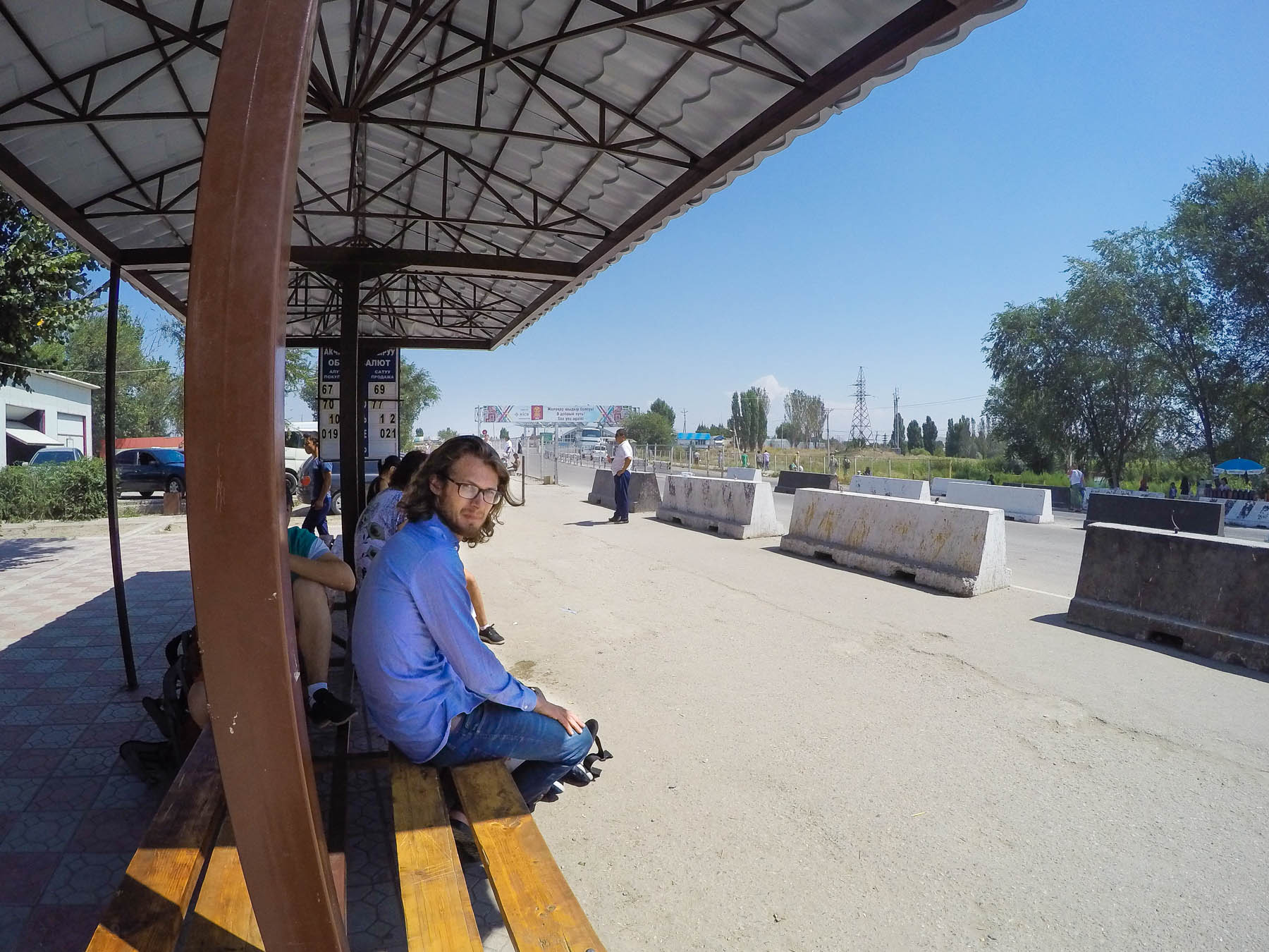 Waiting for a marshrutka at the Kazakhstan - Kyrgyzstan border crossing at Kordai