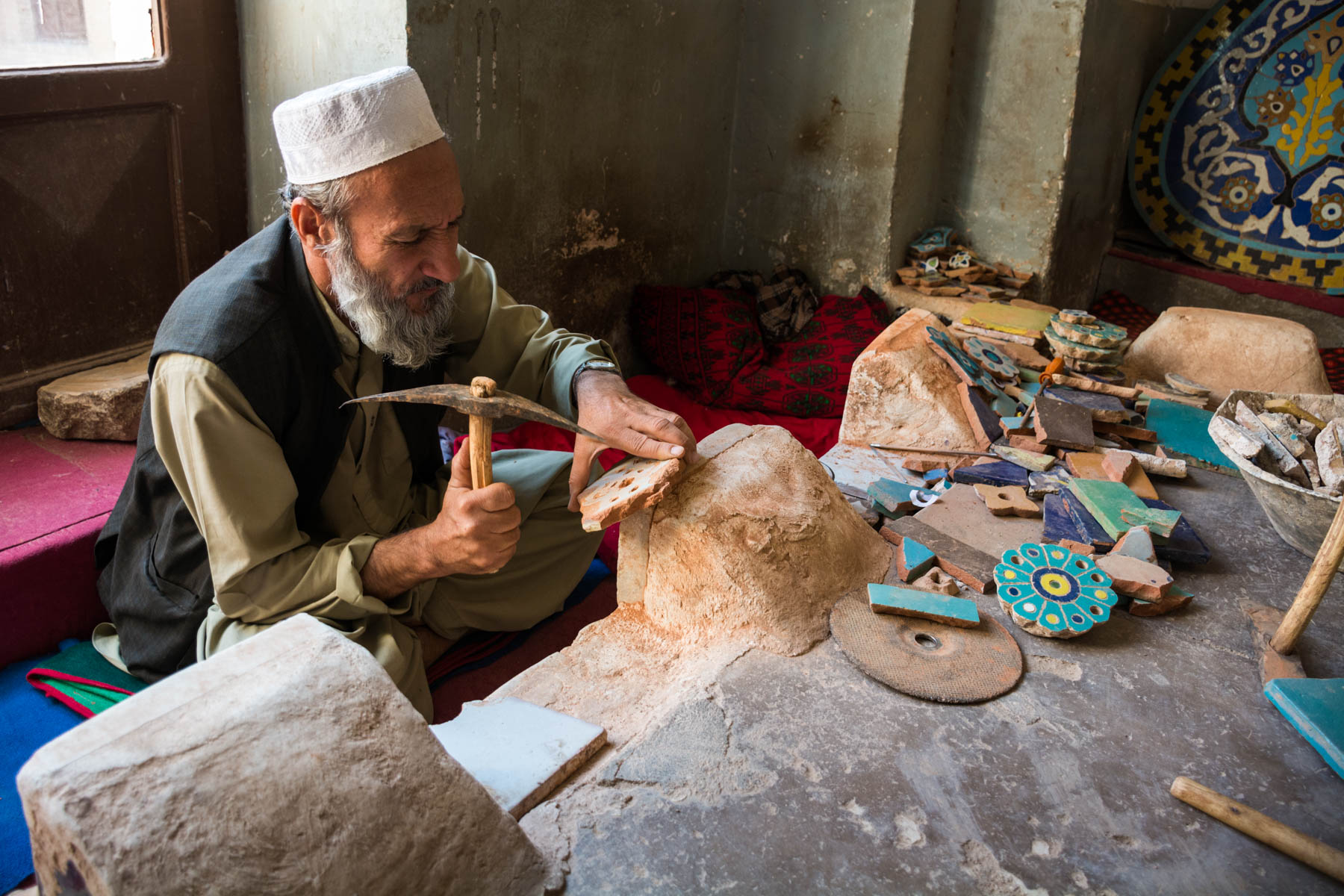 A tile maker chipping away at the Jame Mosque in Herat, Afghanistan