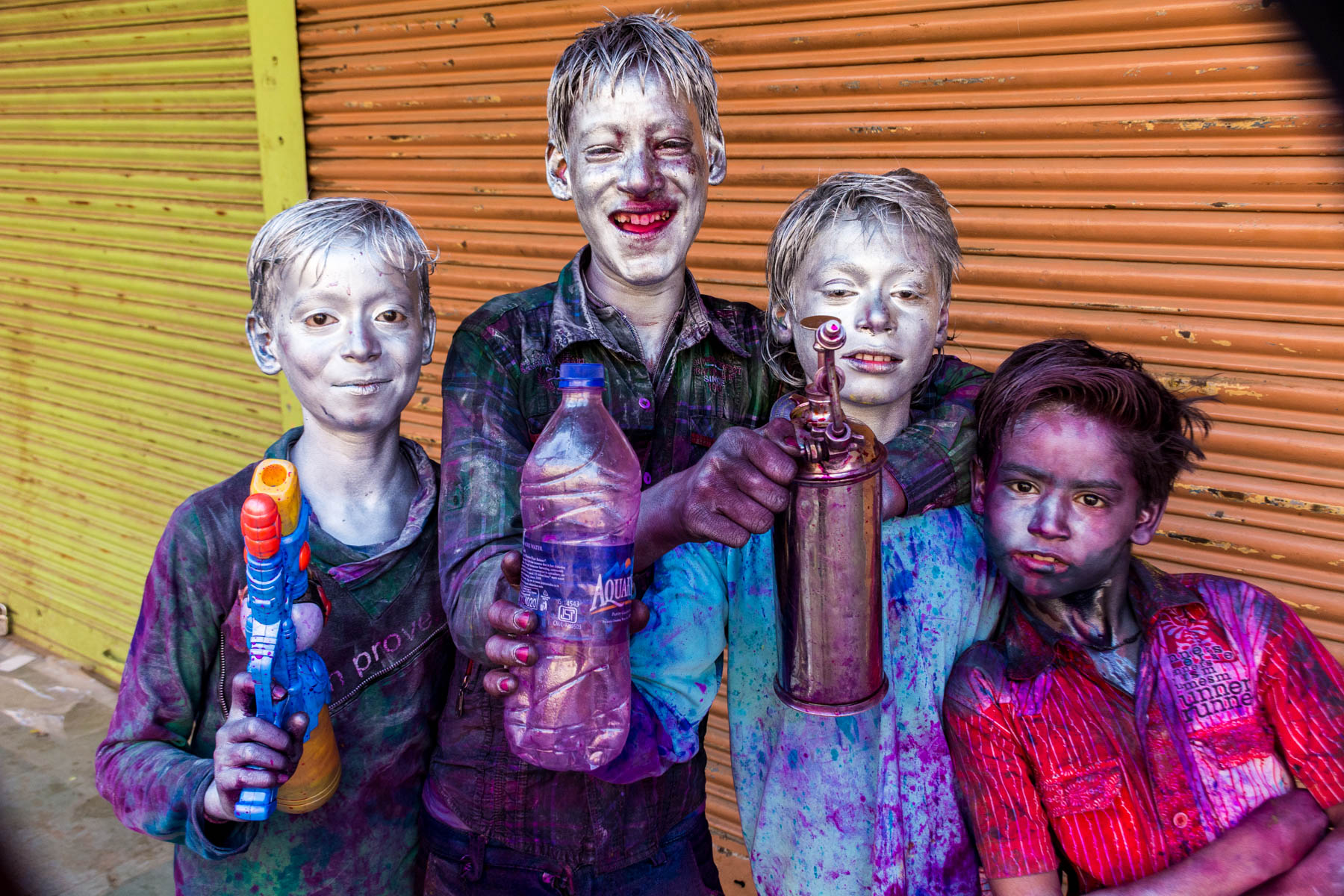 What you need know about playing Holi in Varanasi, India - Local boys painted silver for Holi - Lost With Purpose