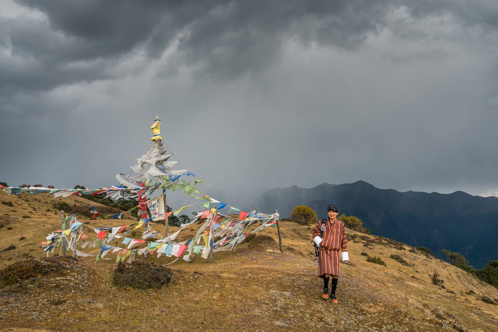 Tour guide Karma walking on the Druk Path between Thimphu and Paro