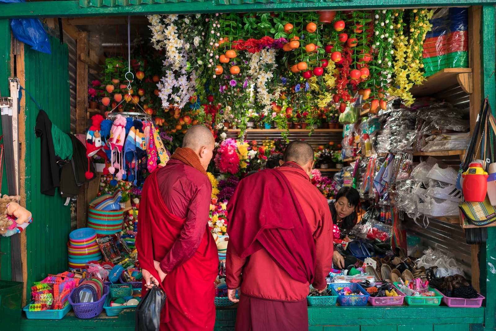 Red robed monks shopping at the handicrafts market in Thimphu