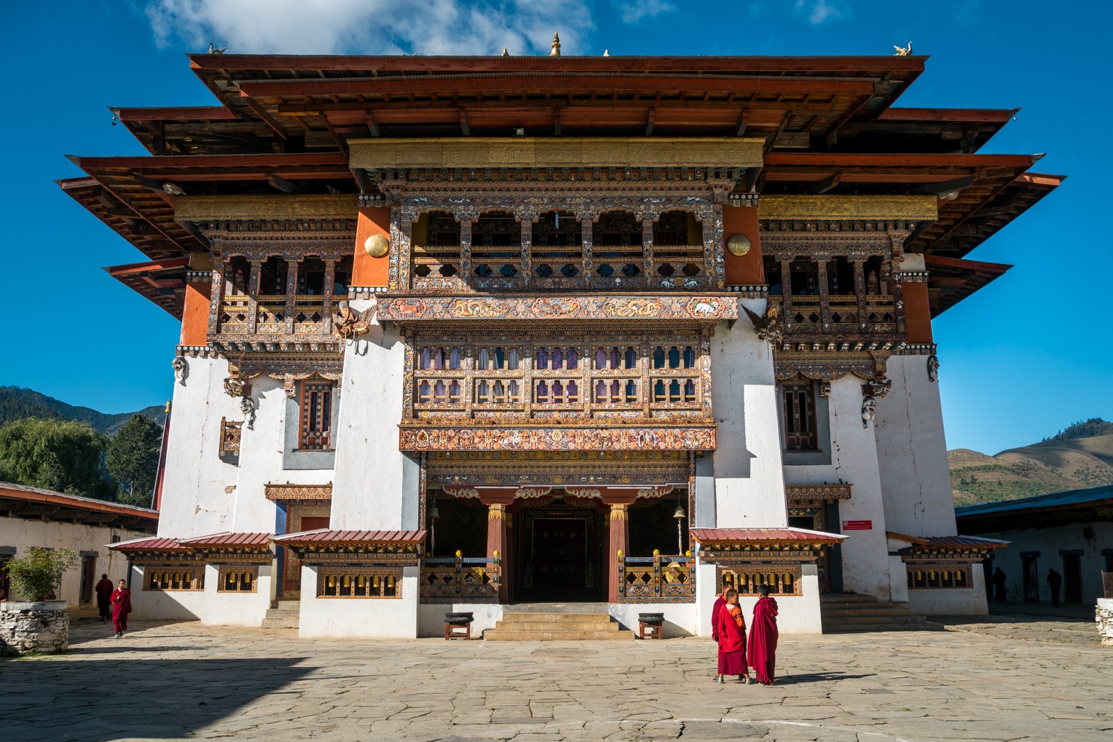 Exterior of Gangtey Monastery with monks