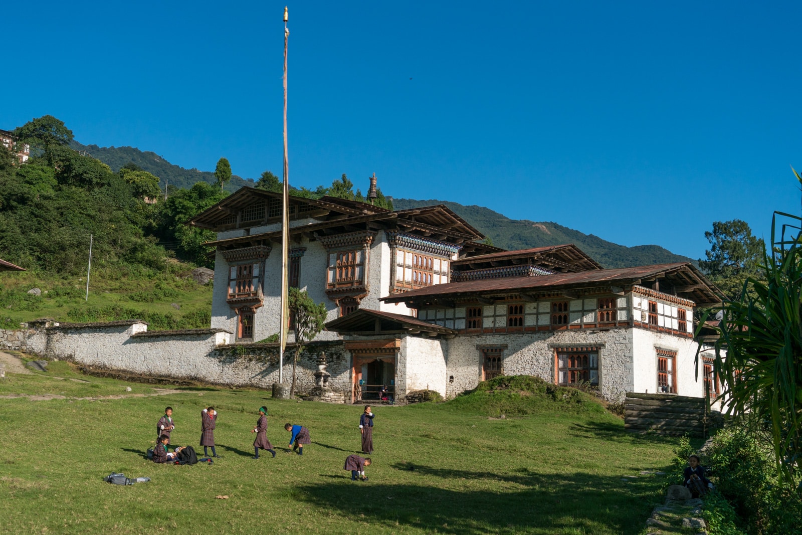 Off the beaten track destinations in Bhutan - School kids outside Kuengarabten palace - Lost With Purpose travel blog