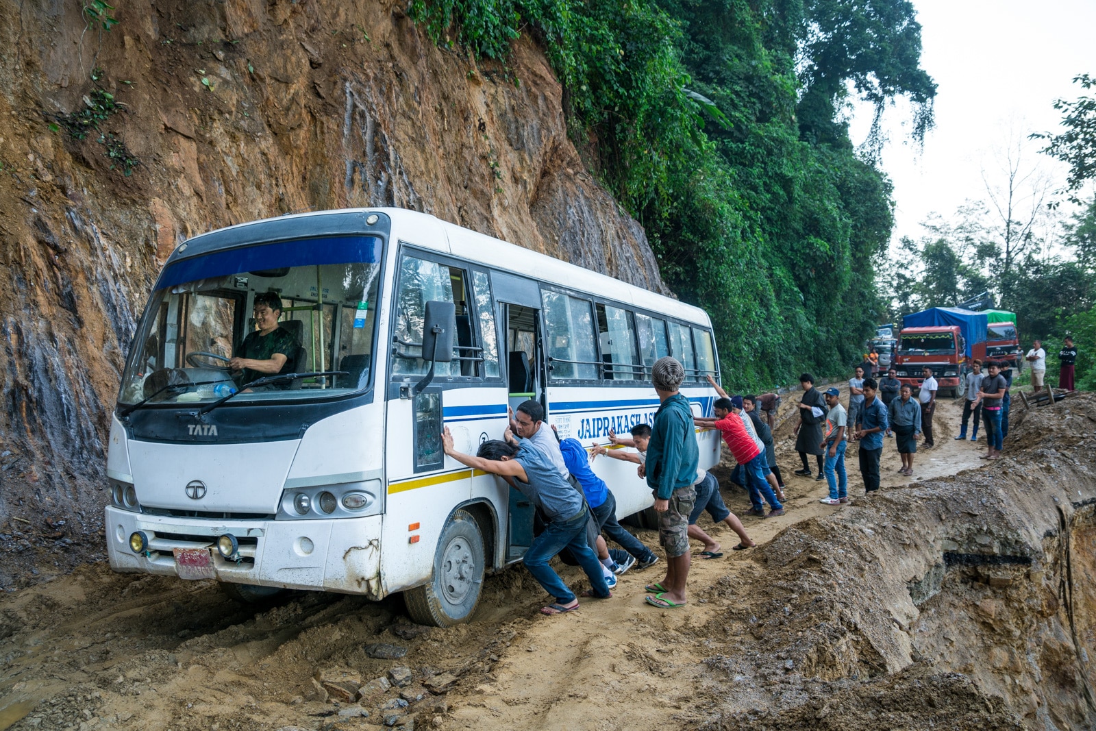 Off the beaten track Bhutan - Bus stuck in the mud - Lost With Purpose travel blog