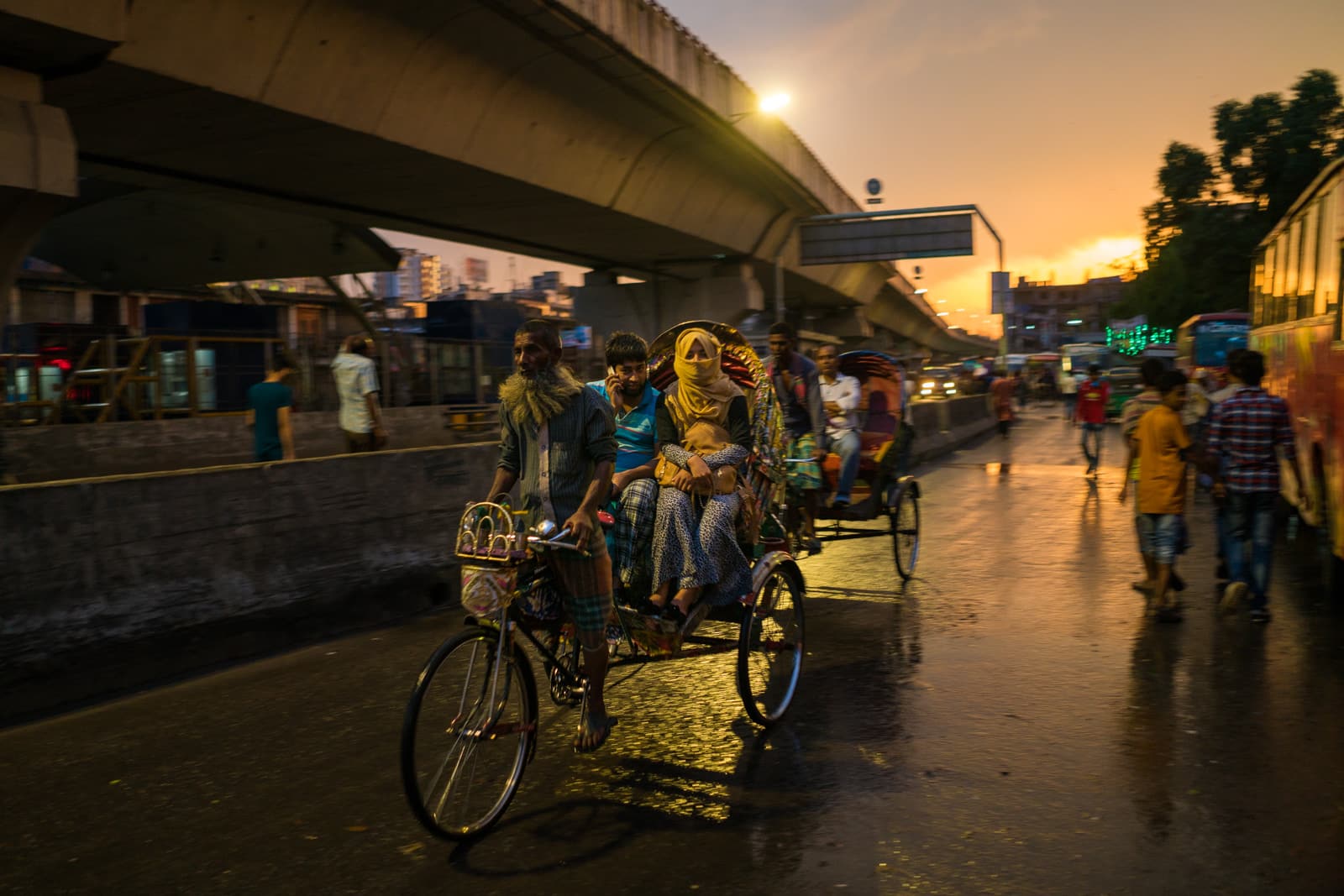 Guide to solo female travel in Bangladesh - Woman and her escort in a rickshaw in Dhaka - Lost With Purpose travel blog