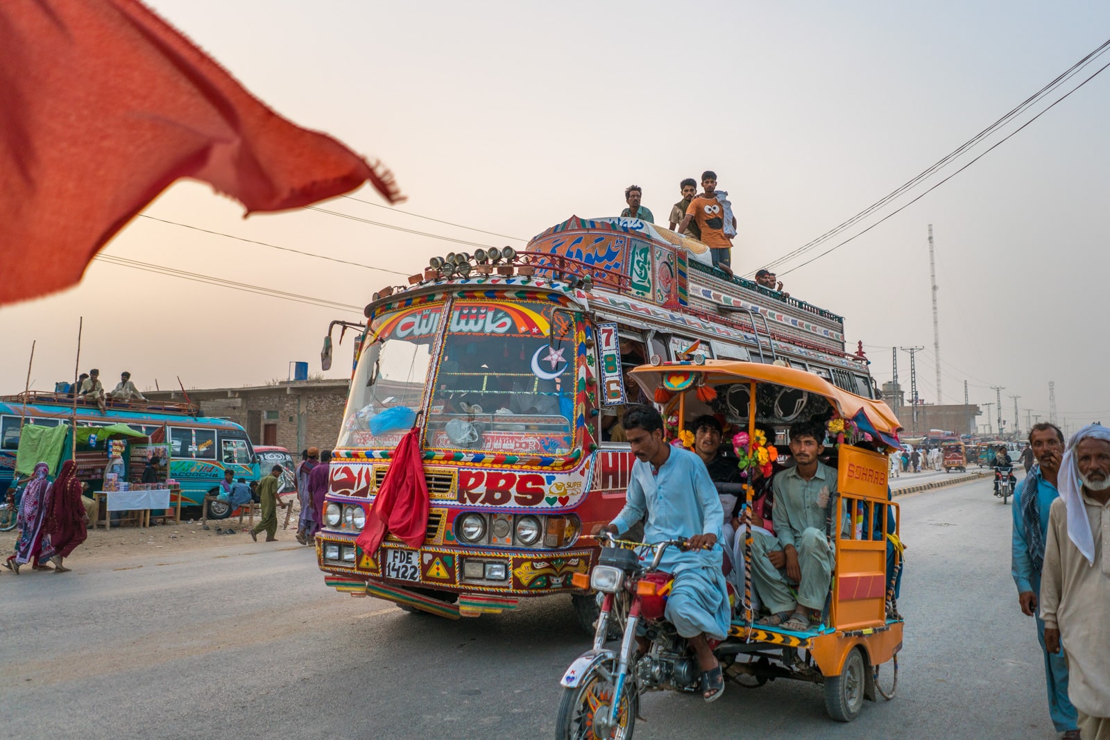 A rickshaw and a local bus transporting people in Pakistan