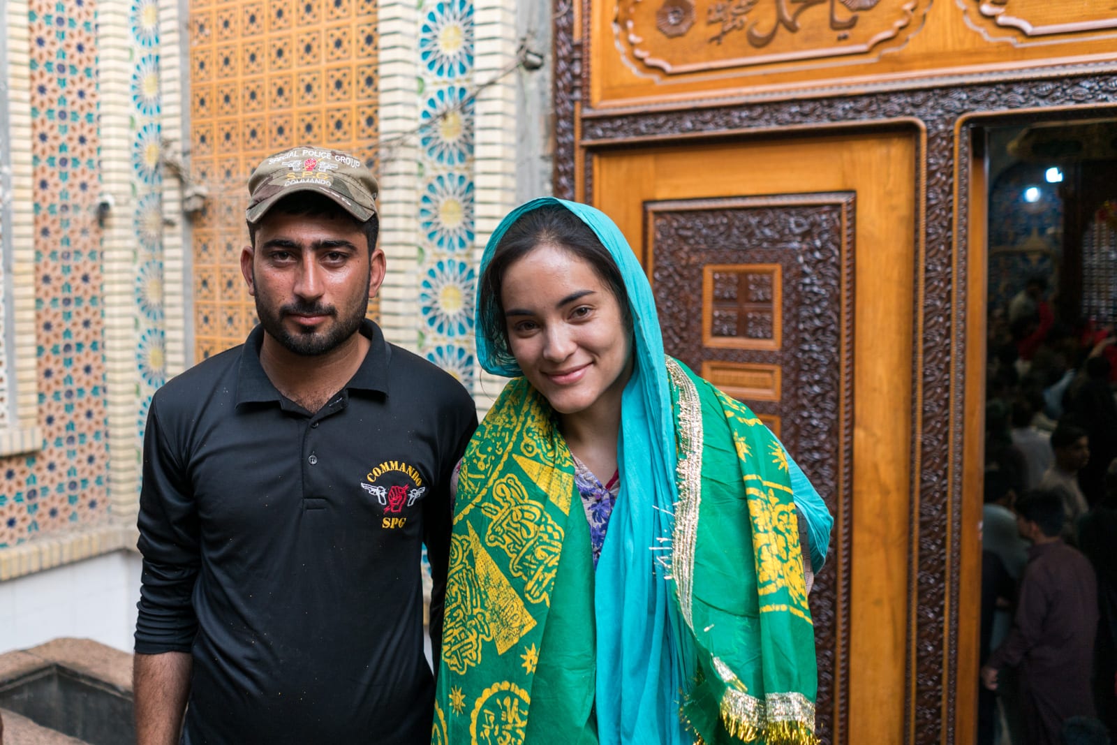 Sindh travel guide - With security guard at urs of Lal Shahbaz Qalandar in Sehwan Sharif, Pakistan - Lost With Purpose travel blog