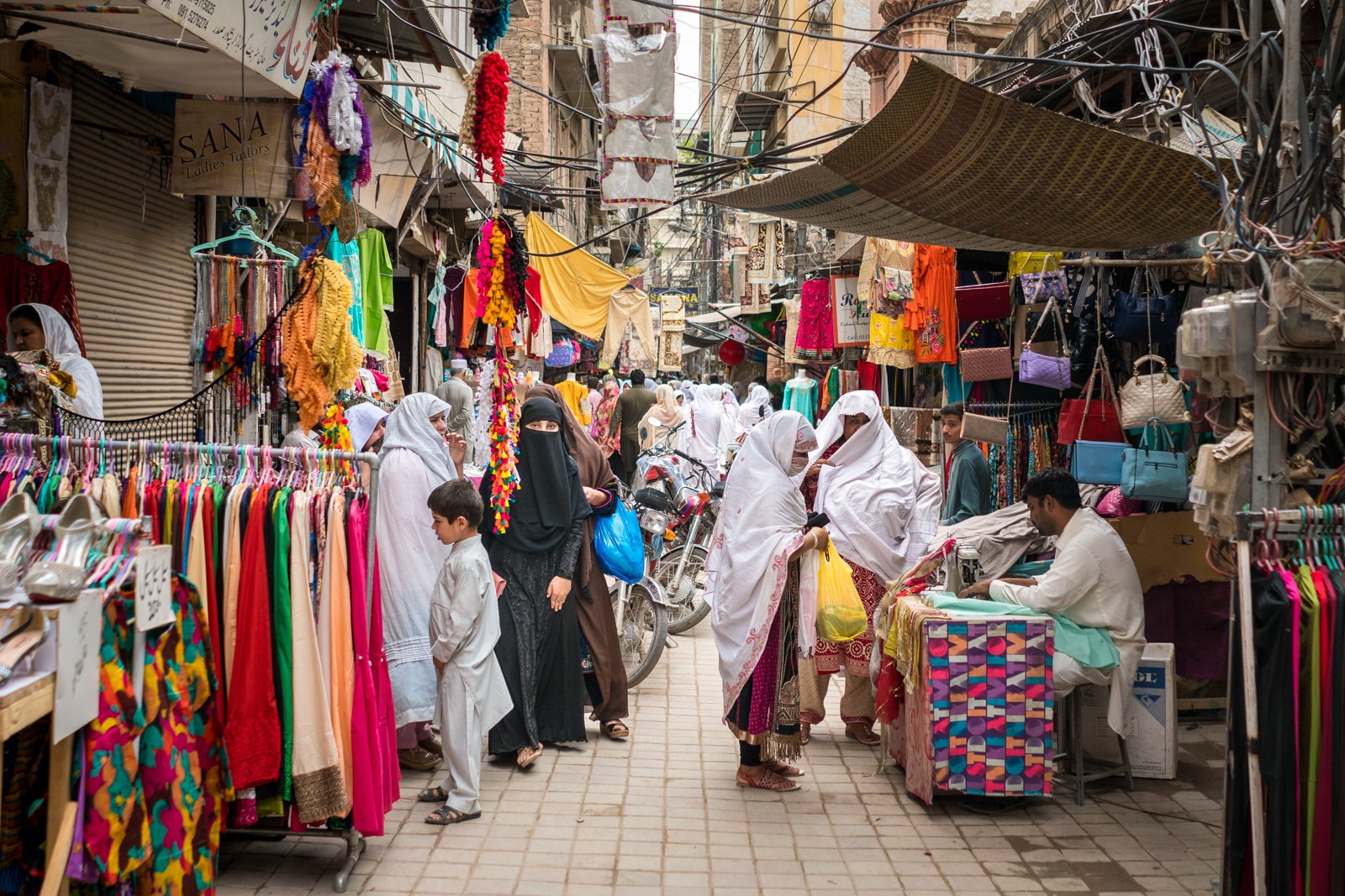 Ladies shopping for clothes in a bazaar in Peshawar, Pakistan