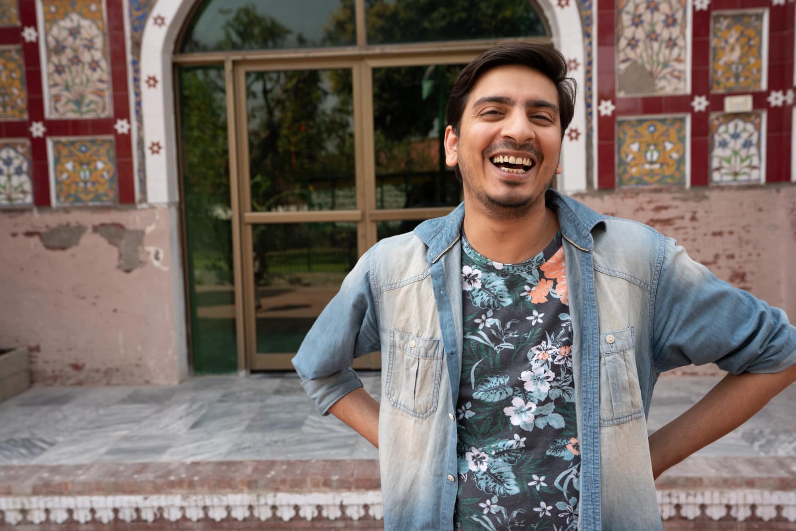 Man laughing at a mosque in Lahore