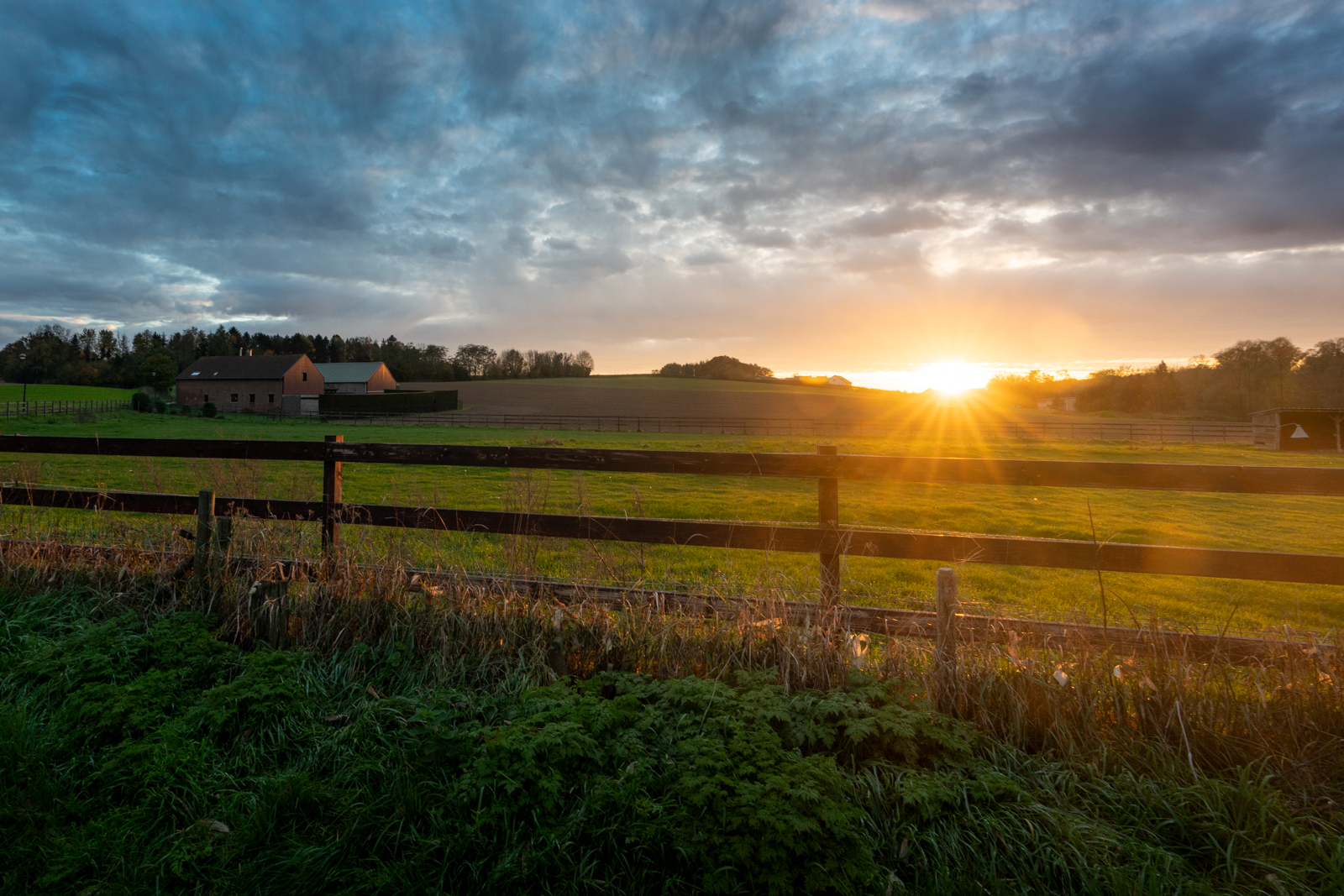 Sunset over a farm field in Leefdaal, Belgium
