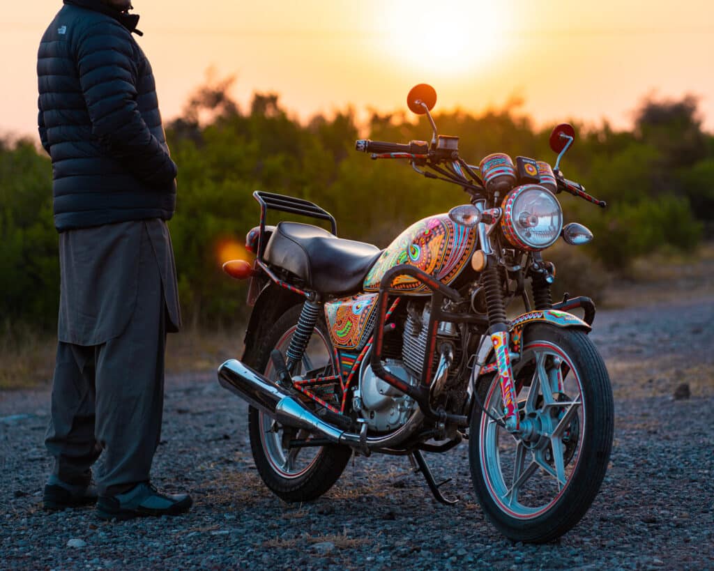 A Suzuki GS 150 motorcycle decorated with Pakistani truck art