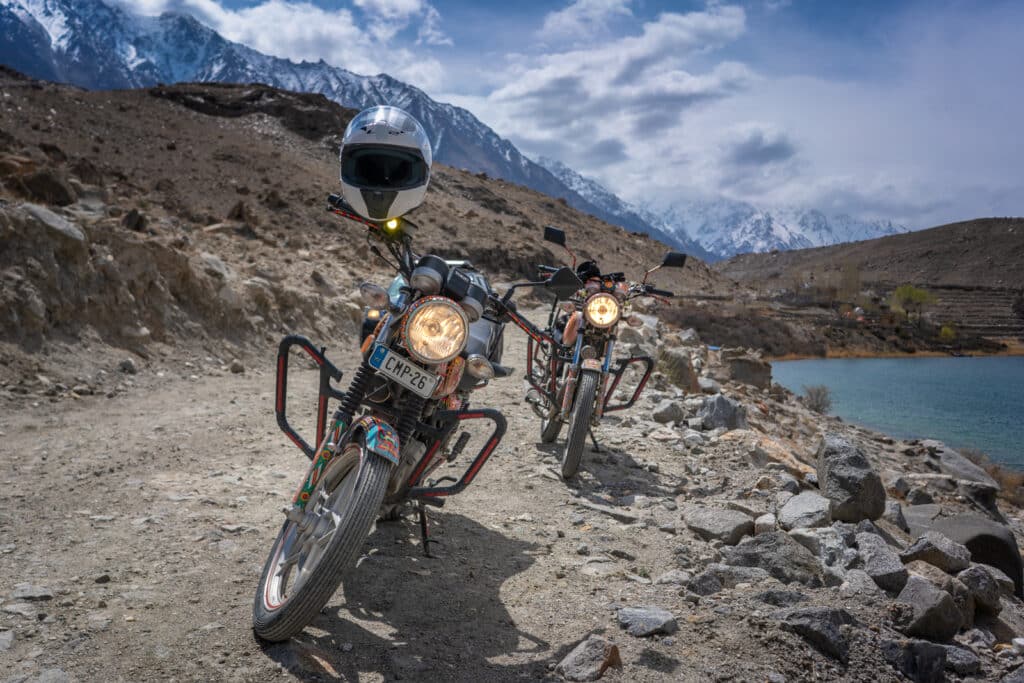 Truck art motorcycles on a mountain track on a Pakistan Motorcycle Tour by Lost WIth Purpose